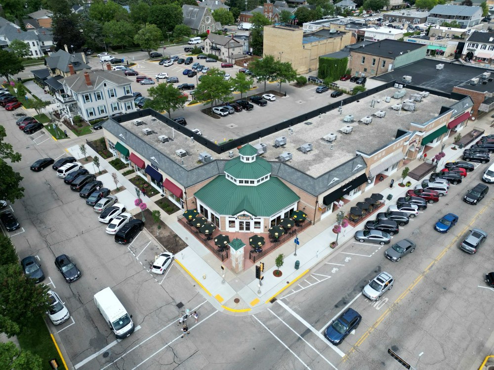 An occupied neighbourhood retail centre seen from above